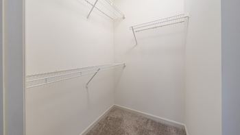 The Hendrix Apartments in Atlanta primary bedroom closet with shelving at The Hendrix, Atlanta, GA